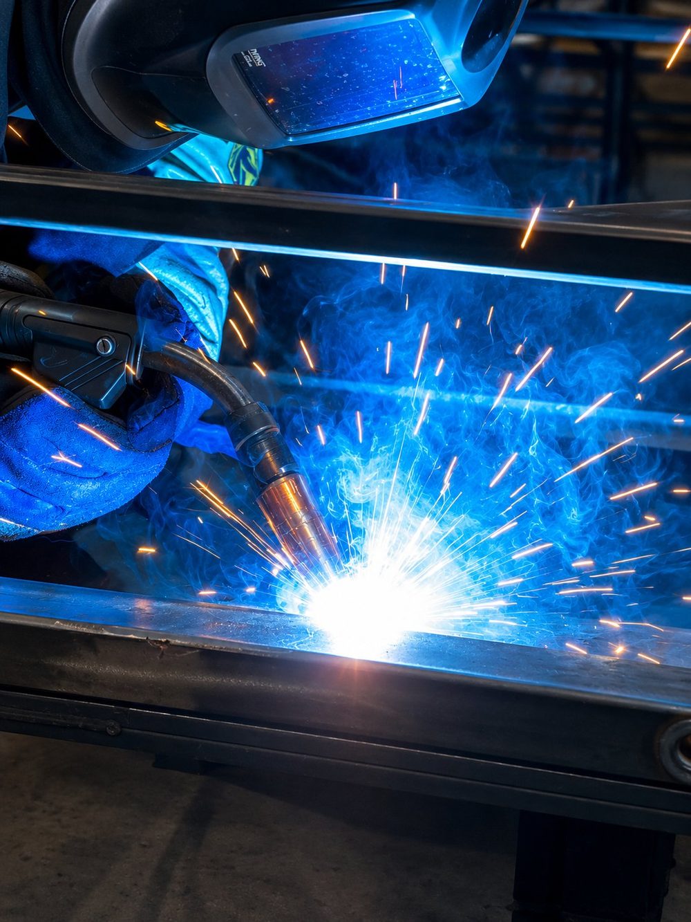 MIG welding a steel frame at Teems Fabrication